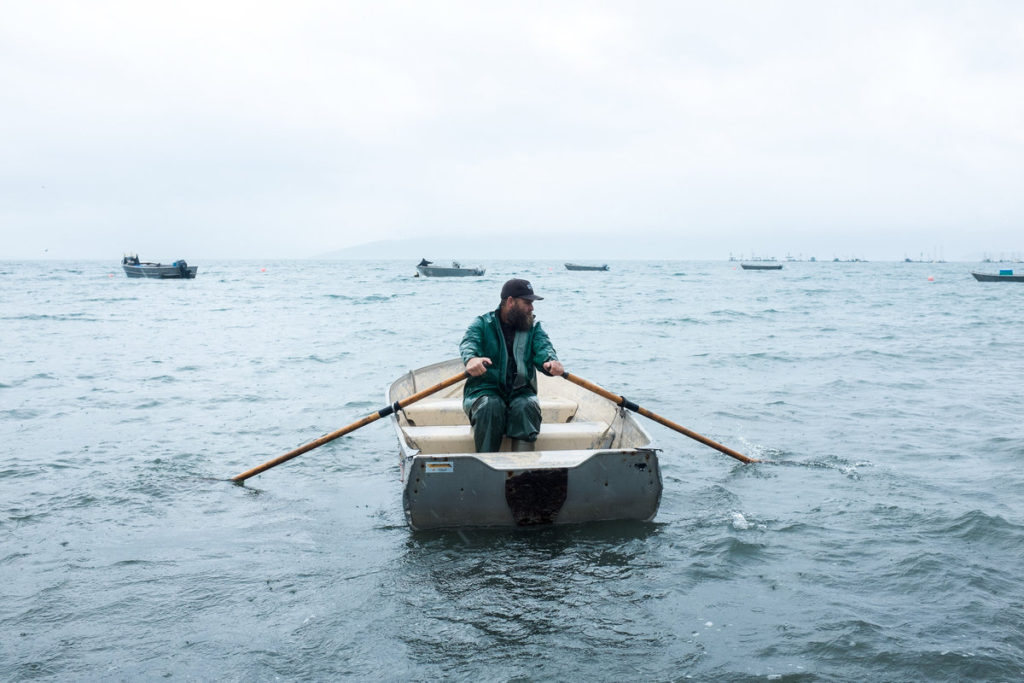 Man Carrying Woman Near Waving Sea by Stocksy Contributor Milles Studio  - Stocksy